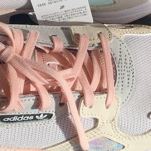 Never worn, new in the box Adidas Pink Falcon.